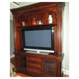 ENTERTAINMENT CENTER ON OVERSIZED PIER BASE