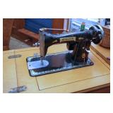Vintage Webster sewing machine in cabinet
