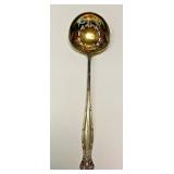 "https://www.ebay.com/itm/124835396046	"	ME1022 STERLING SILVER GOLD TONE SLOTTED SPOON PAT 1894	BIN