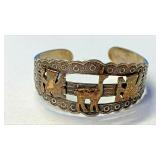 https://www.ebay.com/itm/115149172721	NC596 PERUVIAN CUFF STERLING SILVER BRACELET WITH 18 K GOLD IN