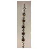 https://www.ebay.com/itm/115399259452	NC606 STERLING SILVER BRACELET WITH CIRLCLES AND CITRINE CLEAR