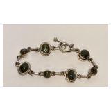 https://www.ebay.com/itm/126144180735 CV1113 STERLING SILVER BRACELET WITH IRREDECSNT STONES AND TOG