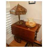 Tea cart, slag glass lamp, Fenton reverse painted hanging lamp (shade only shown)
