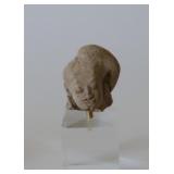 male stone head 12th C. h 2"