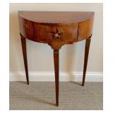 one of a pair of Italian side tables .