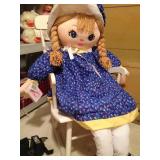 Doll in child rocker