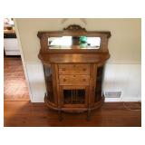 Vintage Tiger Oak Bar Cabinet With Beveled Mirror Back, Curved Glass Side Doors, And Carved Paw Feet.