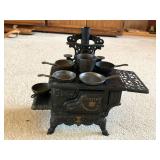 Vintage Crescent Salesman Sample Stove With Mini Pots And Pans.
