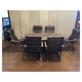 Patio Dining Table Set Consisting Of Oval Faux Stone Finish Table And A Set Of Six Chairs. 