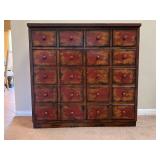 Wooden Cabinet With Distressed Gold And Red Finish On Both The Front And Sides.