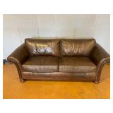 Bernhardt Furniture Classic Brown Leather Sofa With Rolled Arms And Nail Head Trim.