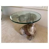 Oriental Occasional Or Accent Table With Carved Wood Figure Holding Up A Thick Piece Of Glass.
