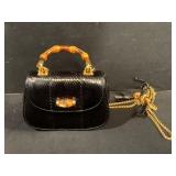 Gucci Small Black Snakeskin Handbag With Bamboo Handle. 