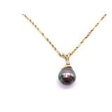 14k Gold 20 Inch Chain With Pearl And Diamond Pendant Set In A 14k Bail. Total Weight: 5g.
