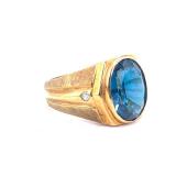 Mens 14k Gold Ring With Deep Blue Center Stone Accented By Diamonds.