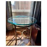 Oval Glass Table 27” W, 23” D, 22” H. $200