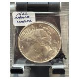 Large Metal Coin in Protective Sleeve
