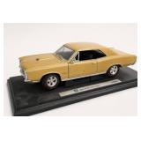 Yellow Die-Cast Model Car on Stand