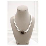 White Bead Necklace with Dark Center Ornament