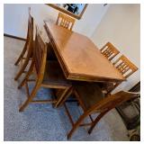 Dining room table with self-contained leaf and 6 chairs
