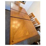 Dining room table with self contained leaf