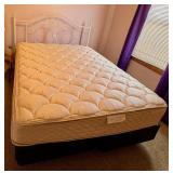 Queen bed with white metal headboard, mattress and box spring