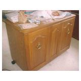 Sewing machine cabinet