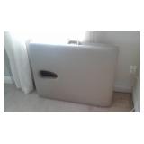 Folding massage table