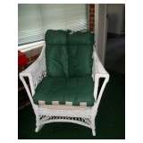 Old white wicker rocker