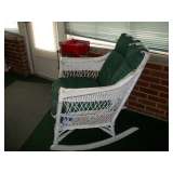 Old white wicker rocker