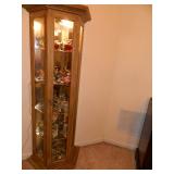 the nice curio is full of Lenox Birds