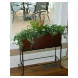 Metal planter with greenery