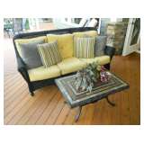 Wicker patio sofa, there is also a rocking chair and one other chair