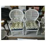 Two white wicker chairs
