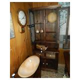 In this lovely old pie safe are vintage rolling pins, butter molds, small bread bowl, and the old ov