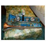 vintage Conn trombone in case and mute cups
