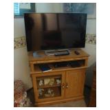 Flat screen TV on small cabinet 