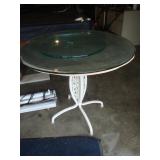 Table with wrought iron base glass top
