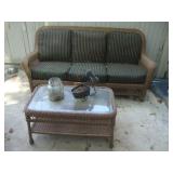 Wicker sofa with glass top table