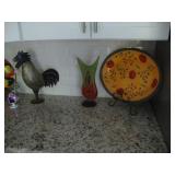 Steel rooster, hand blown glass vase