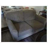 Loveseat with taupe upholstery