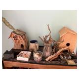 Pottery birdhouses, driftwood