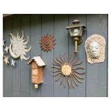 Pottery birdhouses, suns, pottery face w ivy