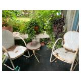 Motel patio chairs, potted plants