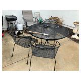 Wrought iron patio table w 4 chairs