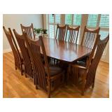 Large solid oak dining table w 8 chairs, top extends to 120"