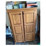 Solid oak cabinet with paneled doors
