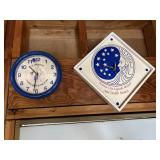 2 blue and white clocks