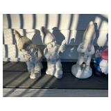 Concrete gnomes playing instruments