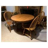 Oak table w 2 leaves and 4 solid oak cahirs